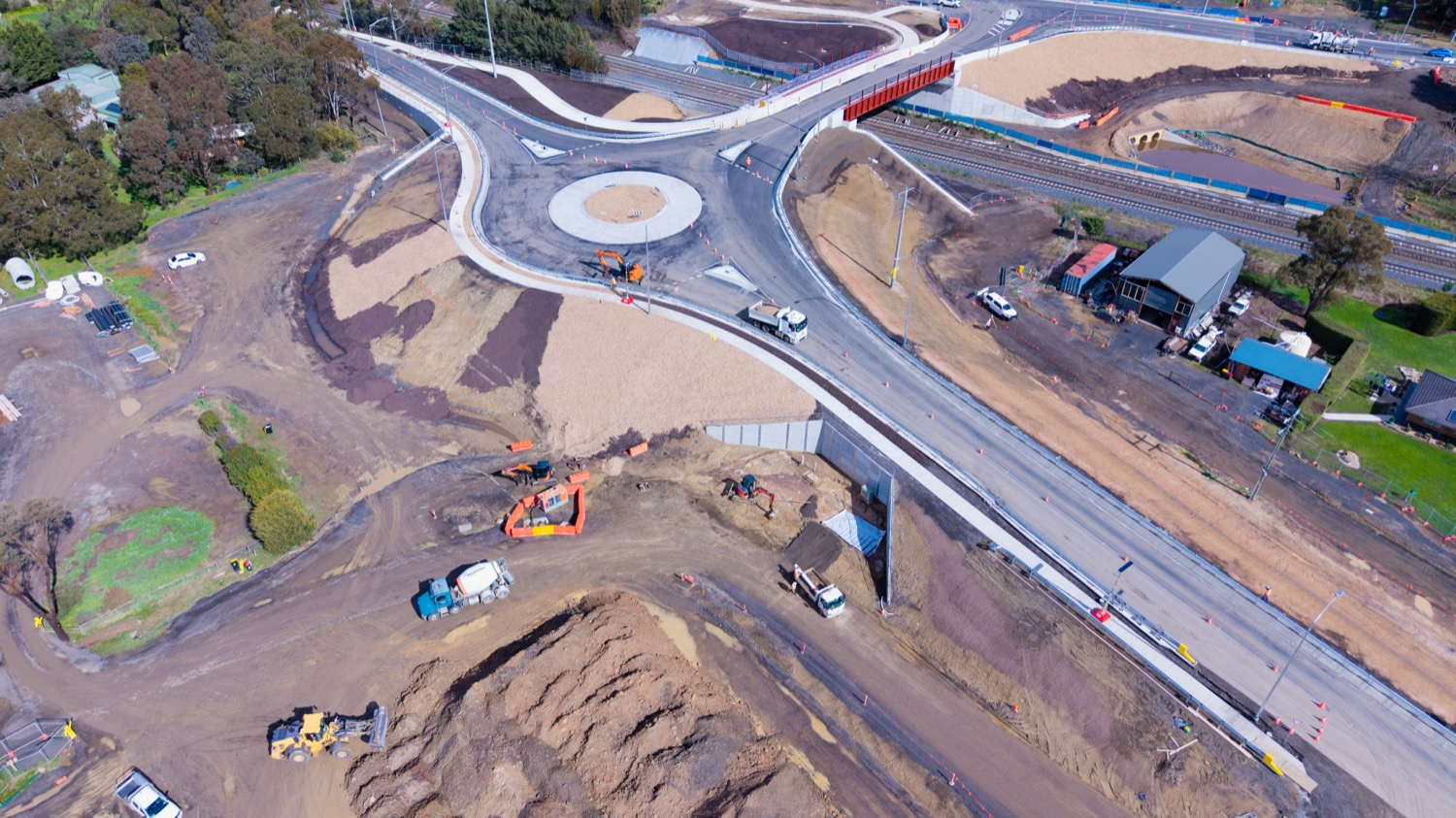 Earthworks, excavators and material stockpiles at the Wandong site